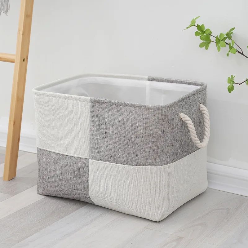 panier à linge gris et blanc pliable poignées cordon